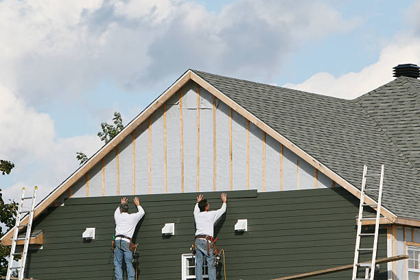 Professional Siding technician working in Beach City, OH